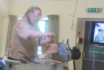 A jig to hold the item to hollow the bowl